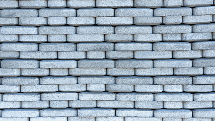 Background of sidewalk tiles. The paving tiles are stacked in rows and create a beautiful flat background.