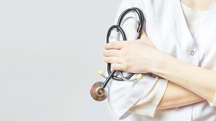 Close up view of young doctor woman with stethoscope on white background, copy space