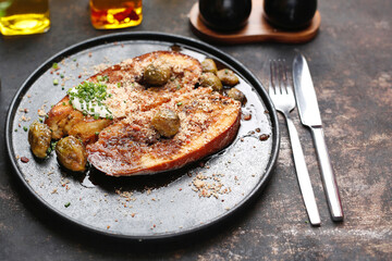 Baked eggplant steak with Brussels sprouts.
Culinary photography. Suggestion to serve the dish.
