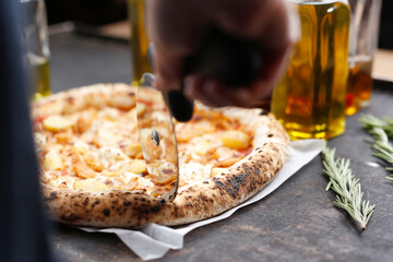 
Pizza with cheese, roasted potatoes, pumpkin and rosemary.
Culinary photography. Proposal for dishes.