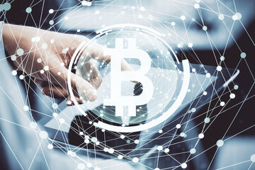 Double exposure of man's hands holding and using a phone and crypto currency blockchain theme drawing.