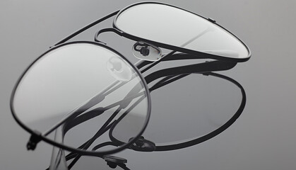 Glasses on the black background, reflection effect