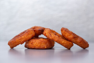 onion rings to beer on a gray background