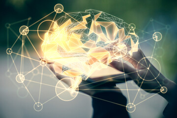 Double exposure of brain sketch hologram and woman holding and using a mobile device.