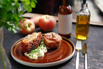 Pork ribs baked with apples served on a plate.
Culinary photography. Suggestion to serve the dish.