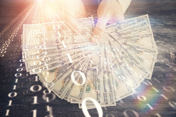 Multi exposure of technology drawing hologram and us dollars bills and man hands. Data concept