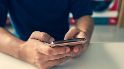 Hands holding cell telephone working mobile devices. smart phone technology e-commerce concept.