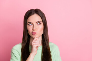 Photo of adorable person arm on chin look empty space decide find out wear sweater isolated on pink color background