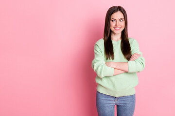 Photo of satisfied young girl folded hands look empty space light green sweater isolated on pink color background