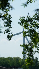 The countryside view with the windmill in the field 