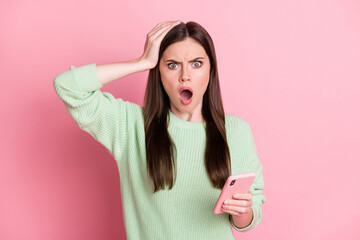 Photo of attractive impressed person hand on head open mouth staring light green sweater isolated...