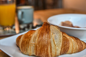 delicious freshly baked croissant. continental breakfast with croissant, coffee, juice and ham. delicious breakfast.