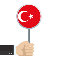Turkey circular flag. Hand holding round Turkish flag. National symbol with moon and star. Vector illustration. 