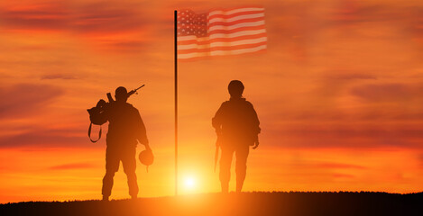 Military man and military woman on USA flag background. American national holidays concept