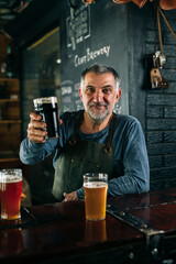 middle age barman serving beer