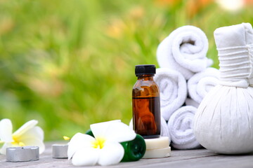 Spa treatments on wooden table and spa candle light atmosphere in wellness centre. beauty spa treatment and relax concept