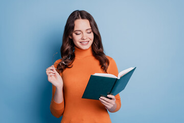 Photo of confident woman read book take off specs study posing on blue background