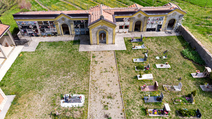 Christian cemetery in the countryside hills Italy