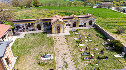 Christian cemetery in the countryside hills Italy