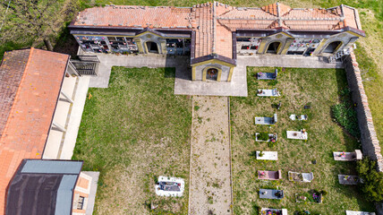 Christian cemetery in the countryside hills Italy
