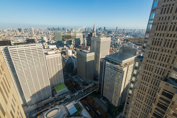 Fototapeta na wymiar Aerial view of downtown Tokyo city skyline showing skyscraper high-rise corporate office buildings in Nishi Shinjuku, Shinjuku, Tokyo, Japan.