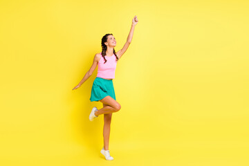 Fototapeta na wymiar Full body photo of pretty happy lady hold look umbrella empty space good mood isolated on yellow color background
