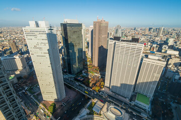  Aerial view of downtown Tokyo city skyline showing skyscraper high-rise corporate office buildings in Nishi Shinjuku, Shinjuku, Tokyo, Japan.