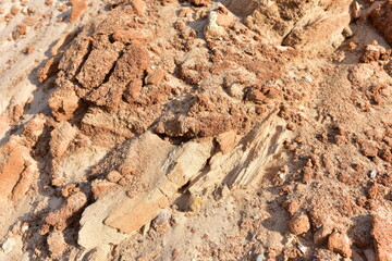 Land structure in open pit mining. Ground background in quarry. Rock texture during earthworks. Sand background and Earth's crust.