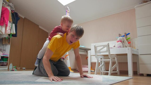 Son on fathers back home in quarantine