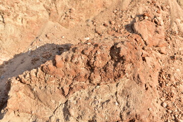 Land structure in open pit mining. Ground background in quarry. Rock texture during earthworks. Sand background and Earth's crust.