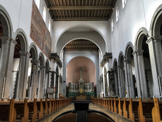 Clean minimalist Gothic interior style architecture inside Roman Catholic church or cathedral with...