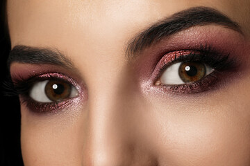 Young woman with evening makeup, closeup. Eye shadow product - obrazy, fototapety, plakaty