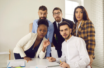 Group portrait of flabbergasted confused business people. Team of corporate employees shocked,...