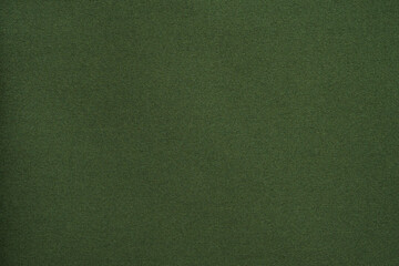 Green fabric texture background close up