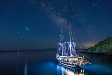 sailboat under the milky way