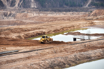 Dozer has been recovering the landscape around the open pit. Process of restoring land. Bulldozer...