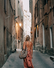 Blonde Girl Stands In The Streets Of A Spanish City