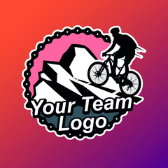 Mountain bike team logotype on a mountain road