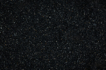 black pebbles laid on the floor as an image for making the dark black background.