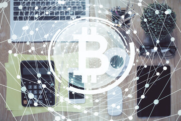 Double exposure of blockchain theme hologram over table with phone. Top view. Crypto technology concept.