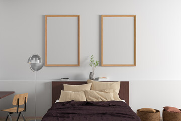 Two vertical  blank posters frames blank poster frame mock up on the white wall in interior of modern bedroom.