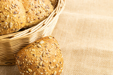 Baguette bread. Rye bakery with crusty loaves and crumbs. Fresh loaf of rustic traditional bread with wheat grain ear or spike plant on natural cotton background. Concept - Cooking at Home.