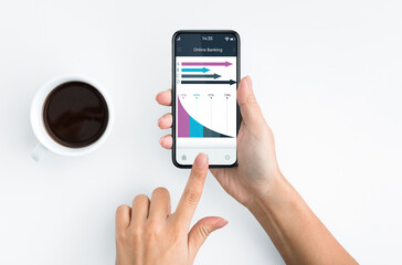 Unrecognizable woman banking online while drinking coffee
