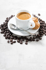 cup of fresh espresso and cookies on and white background, vertical