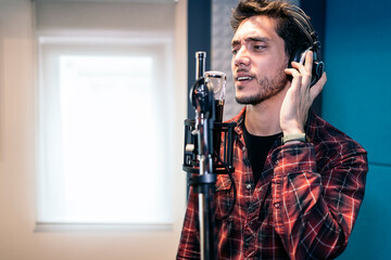 Young Singer Laying Down Tracks In A Recording Studio