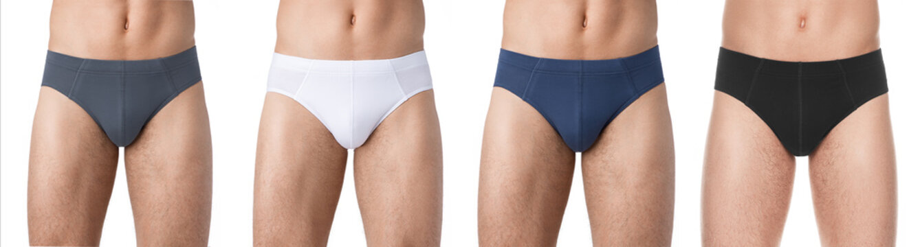 set men's fashion underwear. Strong naked man shows his panties on the body. Athlete with muscles advertises fashionable underwear. Sexy muscular man without shirt. Naked body of young handsome guy