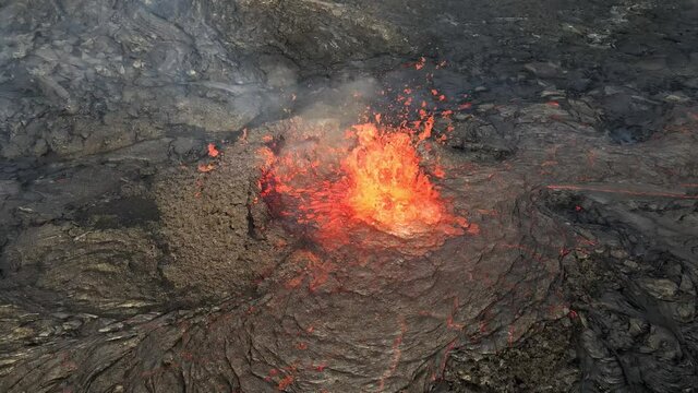lava eruption volcano Slow motion Aerial, Mount Fagradalsfjall, Iceland
Drone shot from Iceland of Hot lava and magma coming out of the crater, April 2021 
