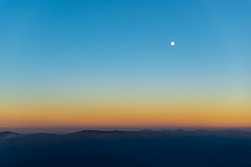 the moon over mountain in morning
