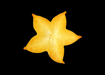 Fototapeta premium Closeup of fresh ripe star fruit cross section isolated on black background