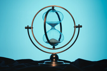 retro hourglass on a bluish background
